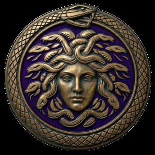 Bronze circular medallion featuring Medusa head with snake hair on purple background, ornate crosshatch border
